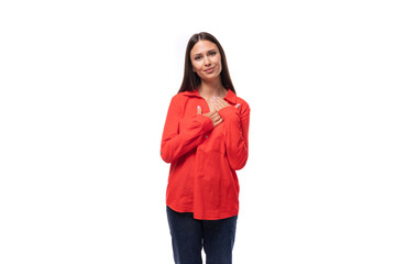 young pretty brunette leader woman with long hair dressed in a red blouse on a white background with copy space
