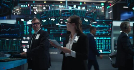 Traders Working in Office with Multiple Computer Screens with Real-Time Stocks, Commodities and Exchange Market Charts. Zoom Out Footage From a Close Up Tablet Computer Screen with Stock Market Chart - Powered by Adobe