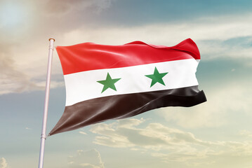 Syria national flag waving in beautiful sky. The symbol of the state on wavy silk fabric.