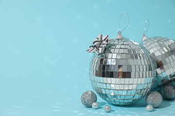 Disco balls with decorations on a light background