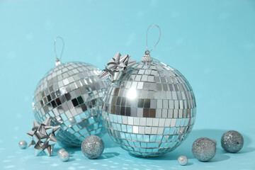 Disco balls with decorations on a light background