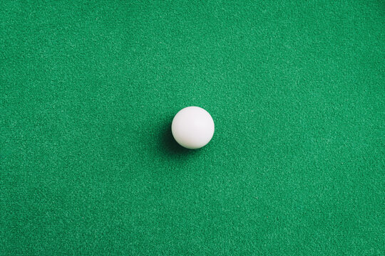 White snooker ball on the snooker green table surface. Sport equipment object.Top view,copy space.