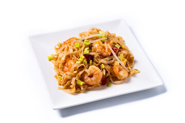 Pad Thai with shrimp and vegetables isolated on white background. traditional thai food