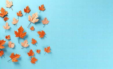 Fototapeta na wymiar Autumn Leaves Dance on a Calm Blue Background, Signaling Seasonal Change