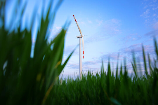 Windmill turbine generating green energy electric.	