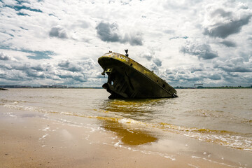 View of the Falkensteiner Ufer and the shipwreck MS Uwe. Historical sight on the Elbe near Hamburg.