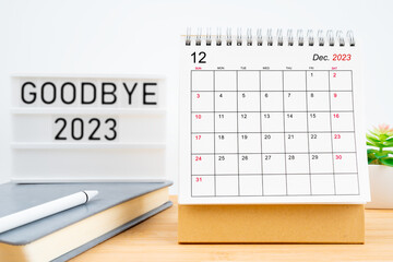 December 2023, Monthly desk calendar and goodbye 2023 text.