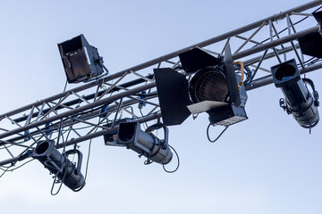 row of many concert lights turned off