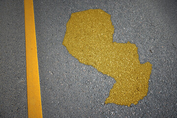 yellow map of paraguay country on asphalt road near yellow line. concept