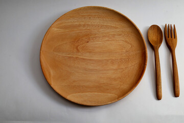 wooden cutlery isolated on white background. wooden dishes and cutlery.