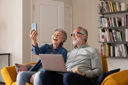 Senior couple on a video call with family at home