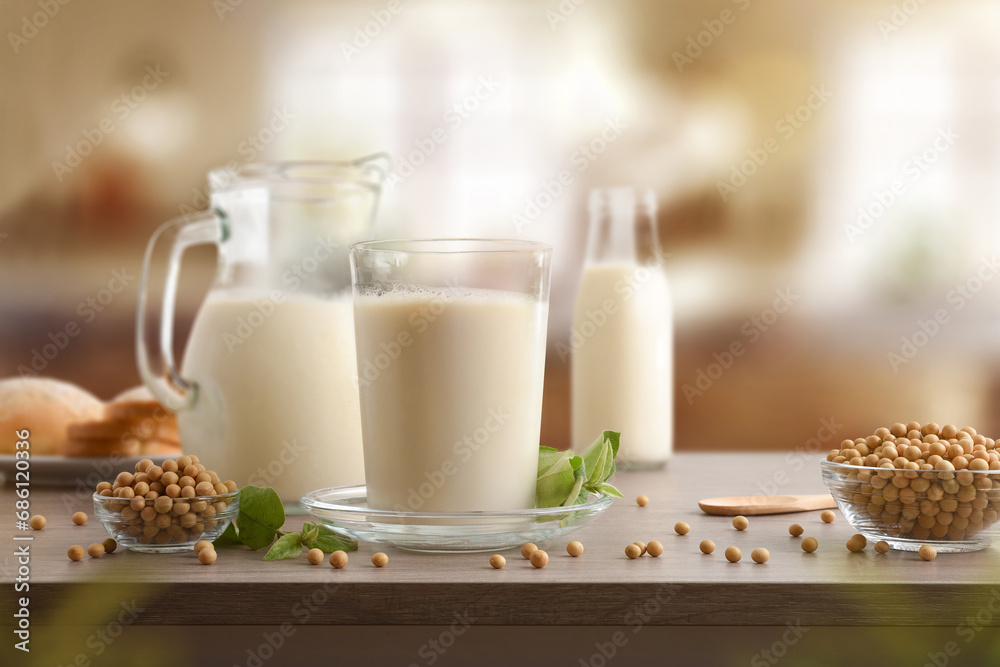 Wall mural Glass containers with soy milk in kitchen