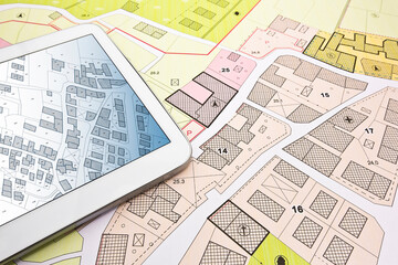 Buildings Permit concept with imaginary cadastral on digital tablet - building activity and construction industry with General Urban Plan - obrazy, fototapety, plakaty