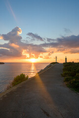 sunrise from the mediterranean sea in mallorca, on the way to the lighthouse by the cliffs
