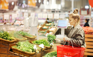 Woman buying vegetables at the market