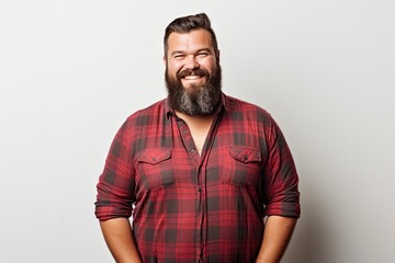 Obraz premium Confident and stylish caucasian man with a beard, exuding happiness and success in casual attire.
