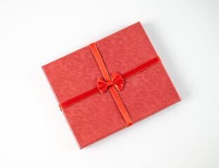 Red gift wrap with bow top view