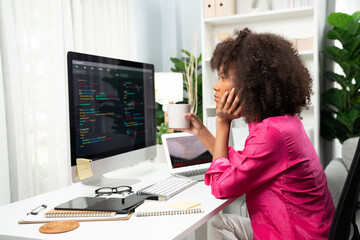 Young working African woman creating coding website developer, thinking data information designer...