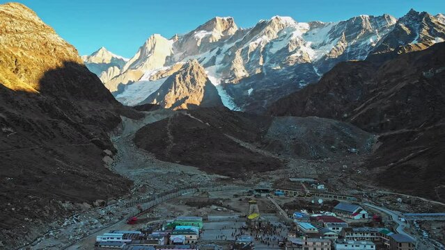 Aerial view of Kedarnath Temple  located on the Garhwal Himalayan Range near the Mandakini River, beautiful Hindu temple surrounded by a huge crowd of devotee