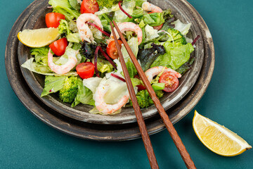 Salad with broccoli and shrimp, Asian food.