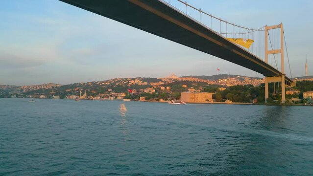 Istanbul Turkey Drone Aerial view below martyrs bridge across bosphorus straight towards ortak&ouml;y capturing traffics crossing and beşiktaş cityscape 
