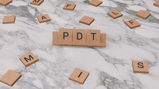 PDT word written on scrabble