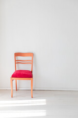 red vintage chair in white room interior
