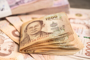 Thai baht banknotes, business saving finance investment concept.