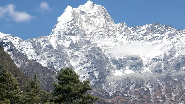 Kusum Kanguru peak mountain range in Himalayas. A snow covered peak with glaciers. One of first high peaks on famous trekking to Everest base camp in Nepal