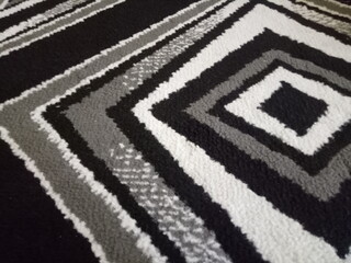 cloth carpet texture with black, white and gray colored lines