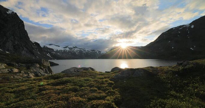 Sunset against the backdrop of the Norwegian mountains. Beautiful Nature Norway natural landscape.