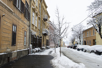  Snow on the street in the city. Sibiu during a winter day. Romania 