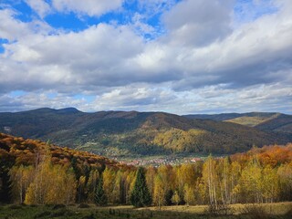 Autumn in the mountains. View of the forest and mountains. Panorama in the Carpathians Ukraine