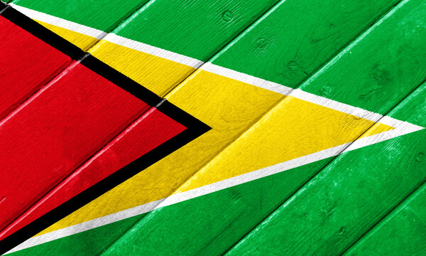 Flag of Co-operative Republic of Guyana on a textured background. Concept collage.
