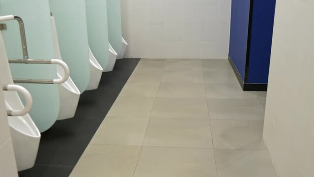A men's public toilet in a shopping mall.