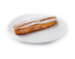 eclair with powdered sugar on a plate