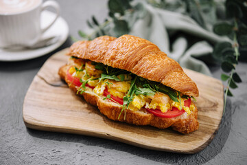 Croissant stuffed scrambled eggs with shrimps