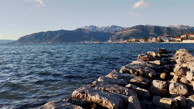 View of Yachts in Porto Montenegro, with mountains in the background. Shot from the Zupa waterfront. 4k