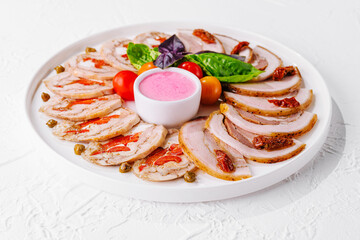 sliced meatloaf with peppers and capers