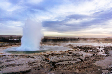 Strokkur geyser Geothermal geysir area in golden circle Iceland in autumn