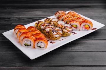 Sushi set on white plate top view