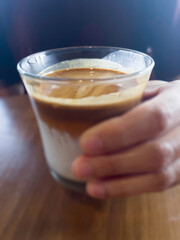 Dirty coffee on wooden table