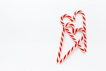 Hearts made of with red Christmas candy canes, New Years decoration