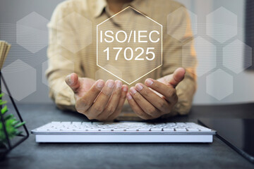 ISO iec 17025 laboratory management standard concept with business person holdoing the iso icon on...