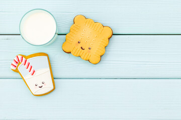 Brekfast with milk and funny cookies, top view. Food for kids