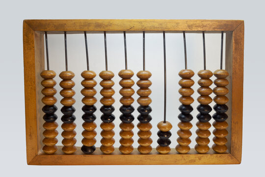 schoty in resting position. Obsolete calculating tool. Wooden frame and colored beads on steel rods