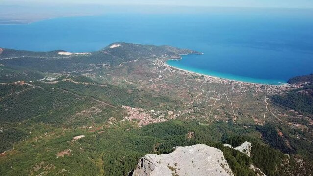 The sea and sea shore of the Thassos Island seen from high altitude on the Ypsarion or Ipsarion mountain in Thassos Island ,  Greece , south-eastern Europe , aerial drone footage.