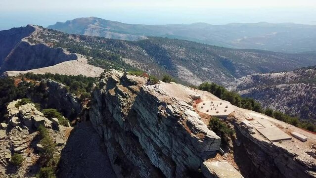 Aerial landscape seen from the drone of the Ipsarion or Ypsarion mountain in Thassos , Greece , the highest mountain of the island with Mediterranean specific vegetation and the Aegean sea shore 