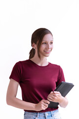Fototapeta premium A young woman cheerful smiling standing and holding digital tablet
