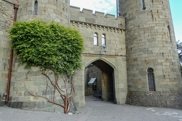 Vorontsov Palace in Crimea in summer. Ancient walls with many columns, turrets and domes. An...